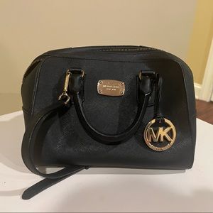 Michael Kor’s Black with gold. Great Condition.